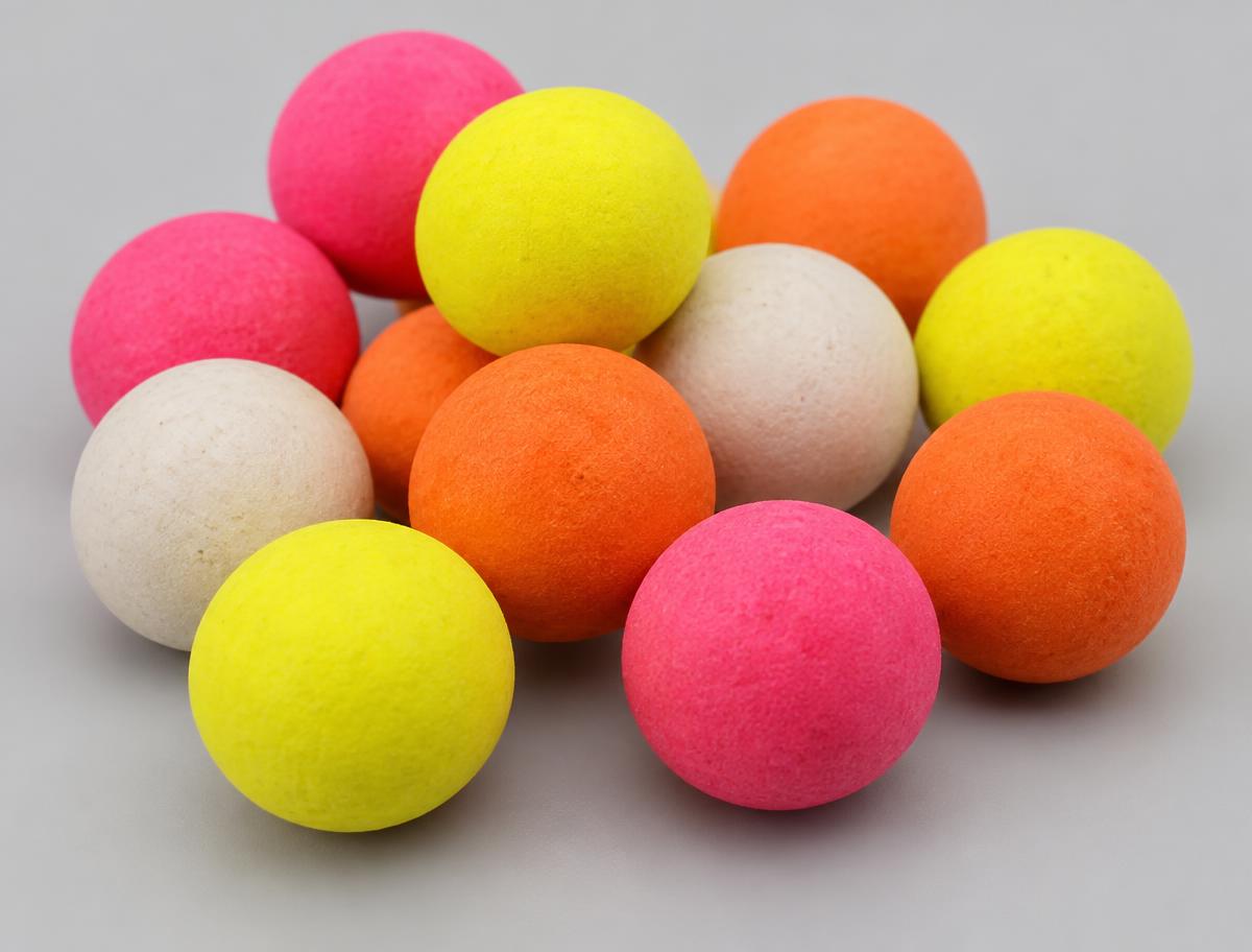 Close-up of bright yellow, pink, orange and white pop-up boilies